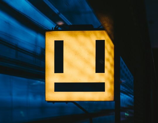What does the upside-down emoji mean?